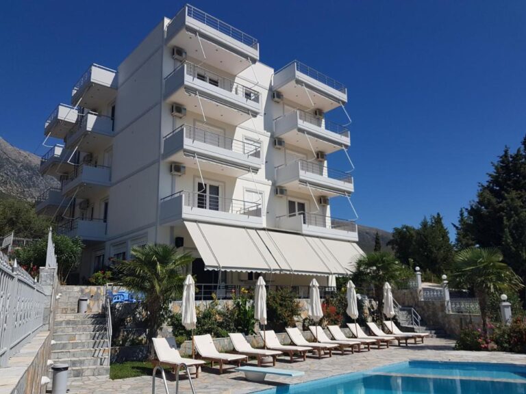 perivolos apartments in albania, outside the building with a clear view of the apartements and the pool.