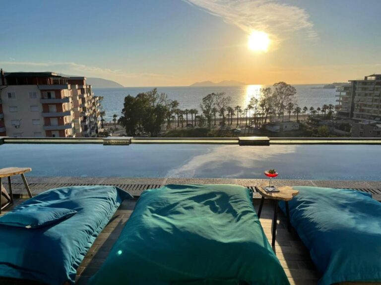 Ames Hotel Spa in Vlorë poolside view with sunset