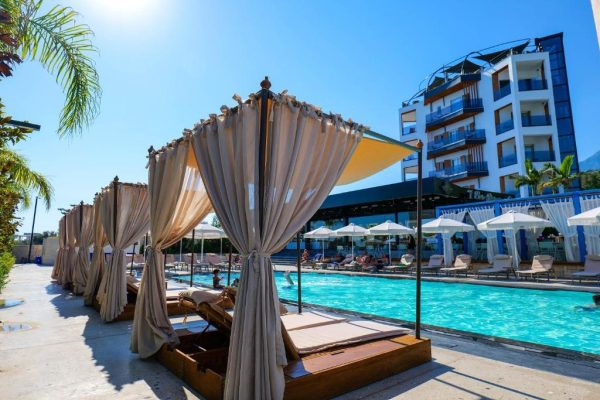 Blue Boutique Hotel in Albania at the poolside of the hotel where you can sun and enjoy the summer