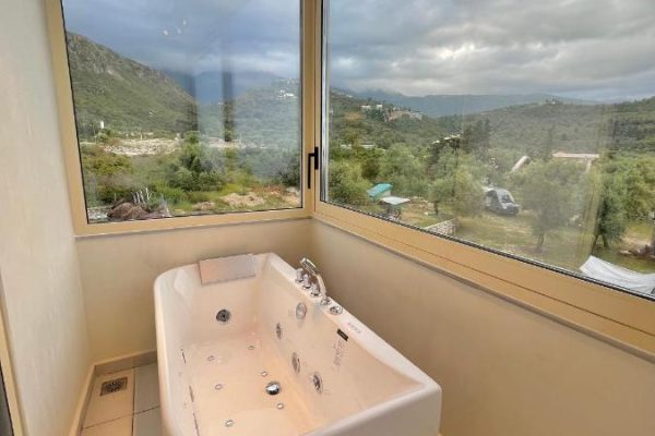 Dimitri Hotel in Himare spa bathtub with a stunning view