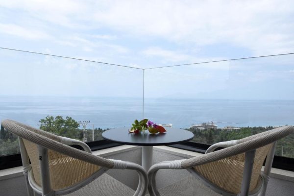 gogo's boutique hotel on de balcony with a stunning view of the ocean overlooking everything under you