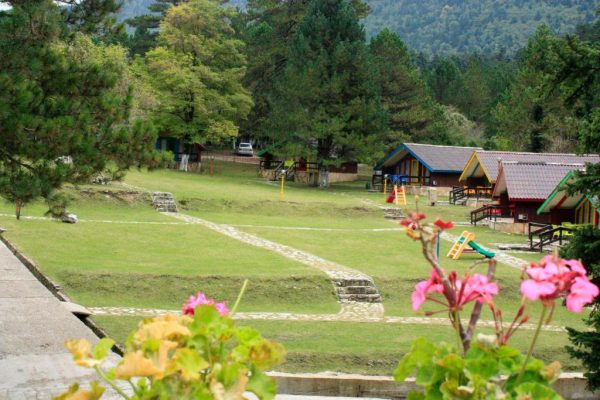 llogora tourist village outside where the playground is for the kids