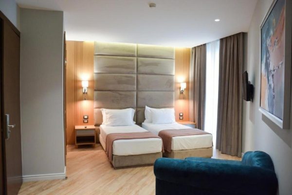 Sea View Hotel with two single beds and a living space perfect for a friendly vacation