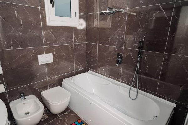 vila apartments kadare toilet with the bath and shower